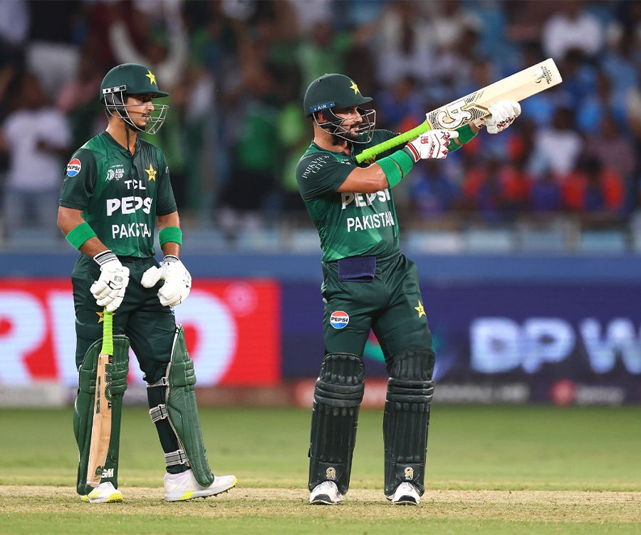 Sahabzada Farhan and another player holds the CA Gold 20K Bat